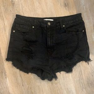 Black jean shorts with rips and frayed bottom